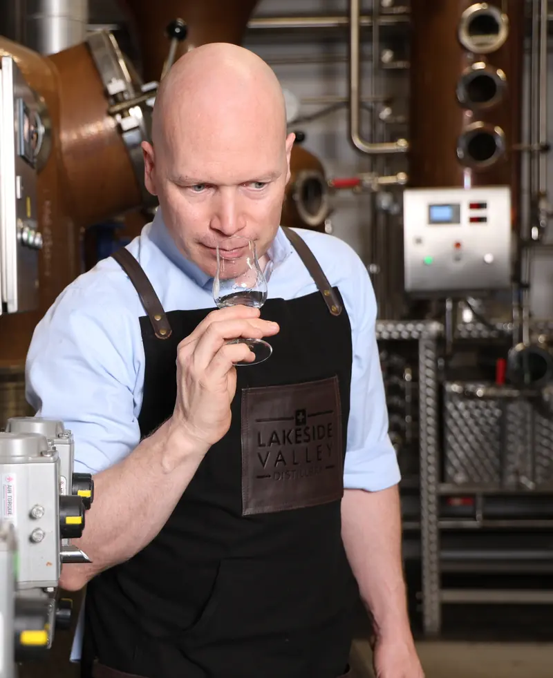 Marcel Amann checking a distillate in a nosing glass